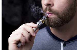 Person vaping with a vape device