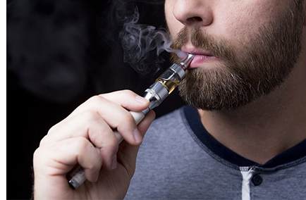 Person vaping with a vape device