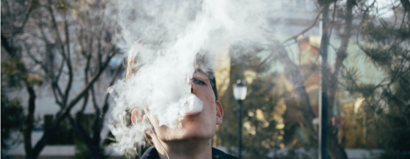 man vaping outside