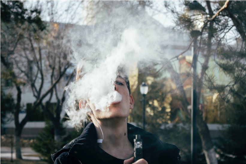 man vaping outside