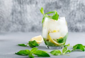 a glass of mint icy lemon water